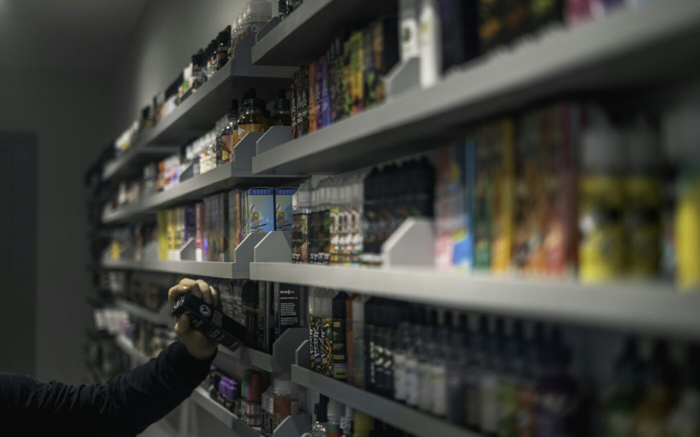 Vape shop shelves stocked with e-liquid bottles