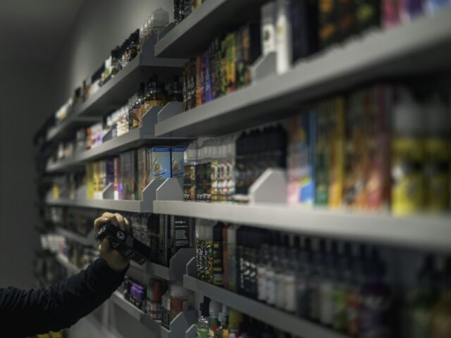 Vape shop shelves stocked with e-liquid bottles