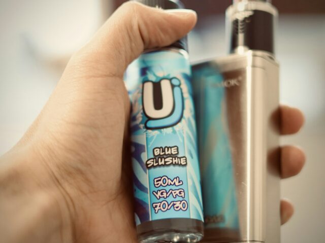 Hand holding a refillable pod