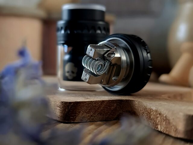 Tank and atomizer parts on a wooden table