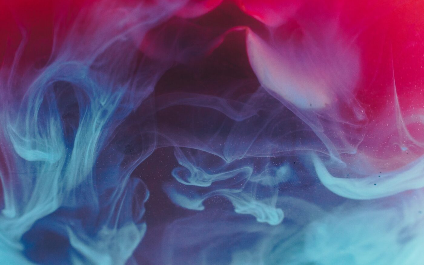 Abstract red and blue smoke on black