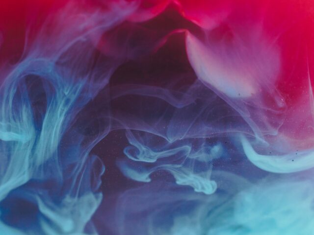 Abstract red and blue smoke on black