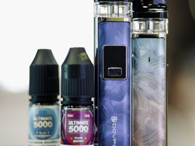 E-liquid bottles and devices on a table