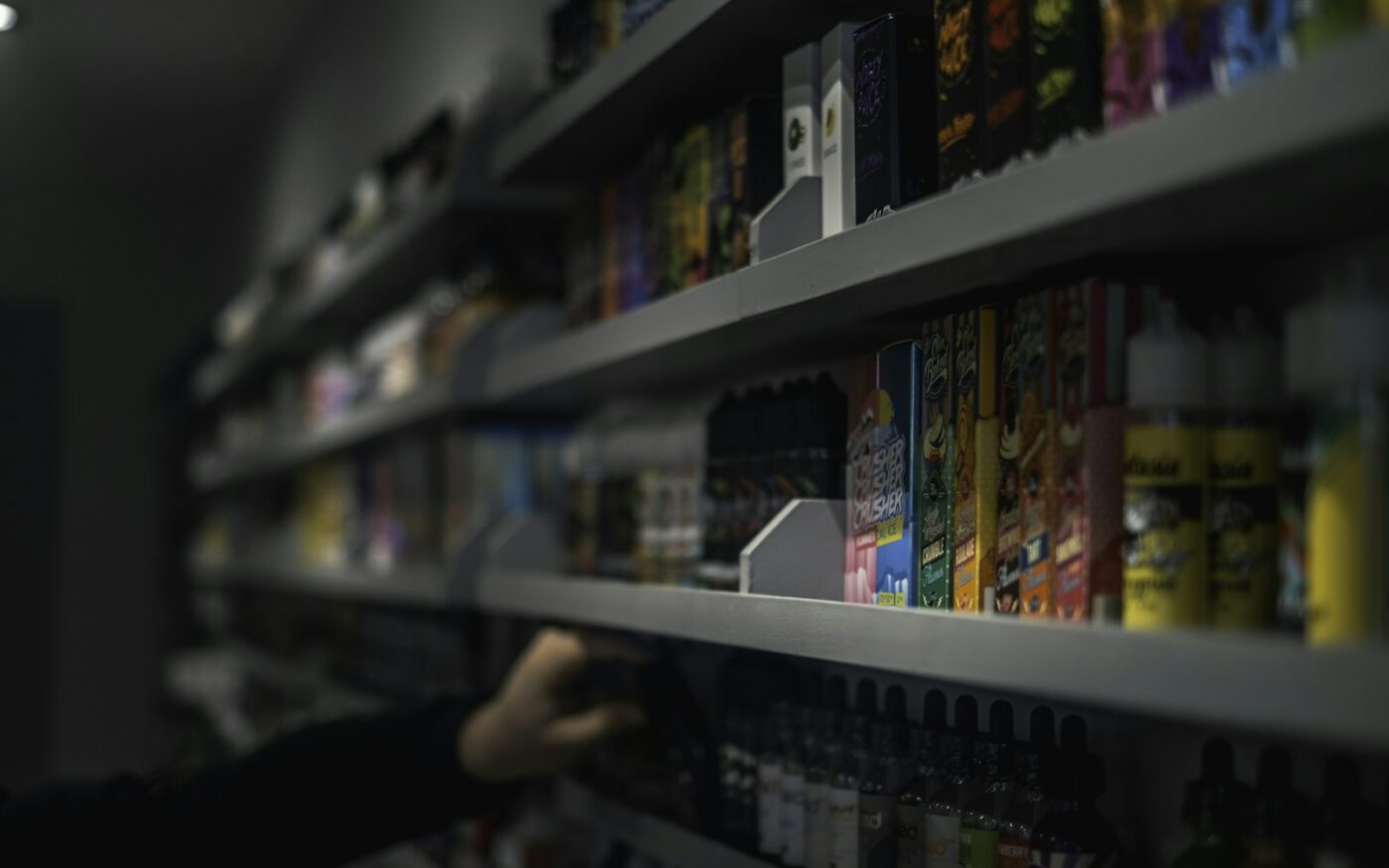 Hand holding a boxed vaping product