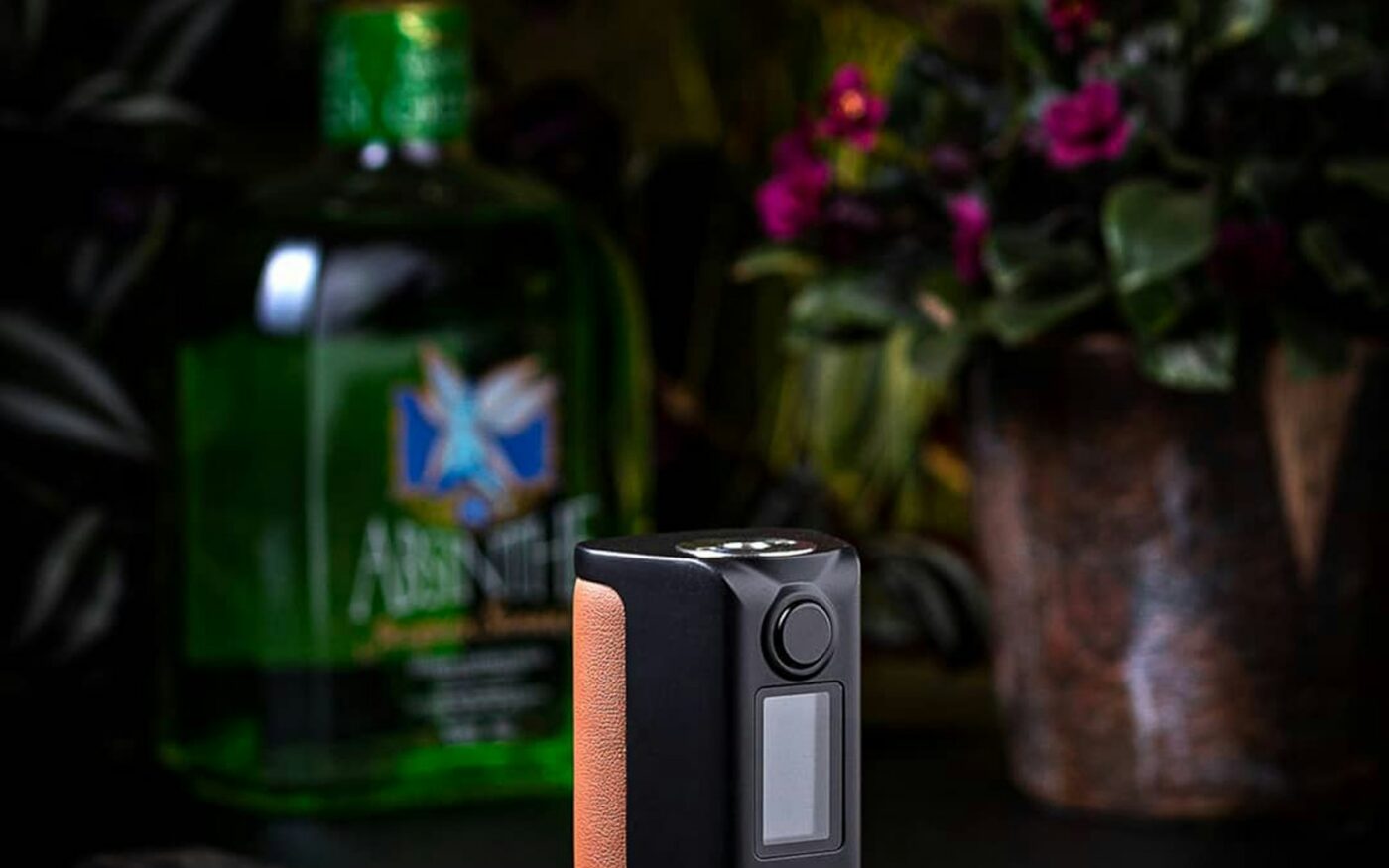 Compact black box device with a small screen and wood side panel