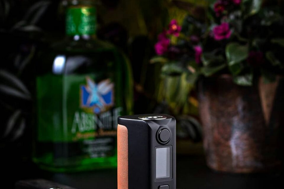 Compact black box device with a small screen and wood side panel
